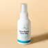 A white cylindrical spray bottle labeled "Prebiotic Get Glowing Setting Mist" by Bea&